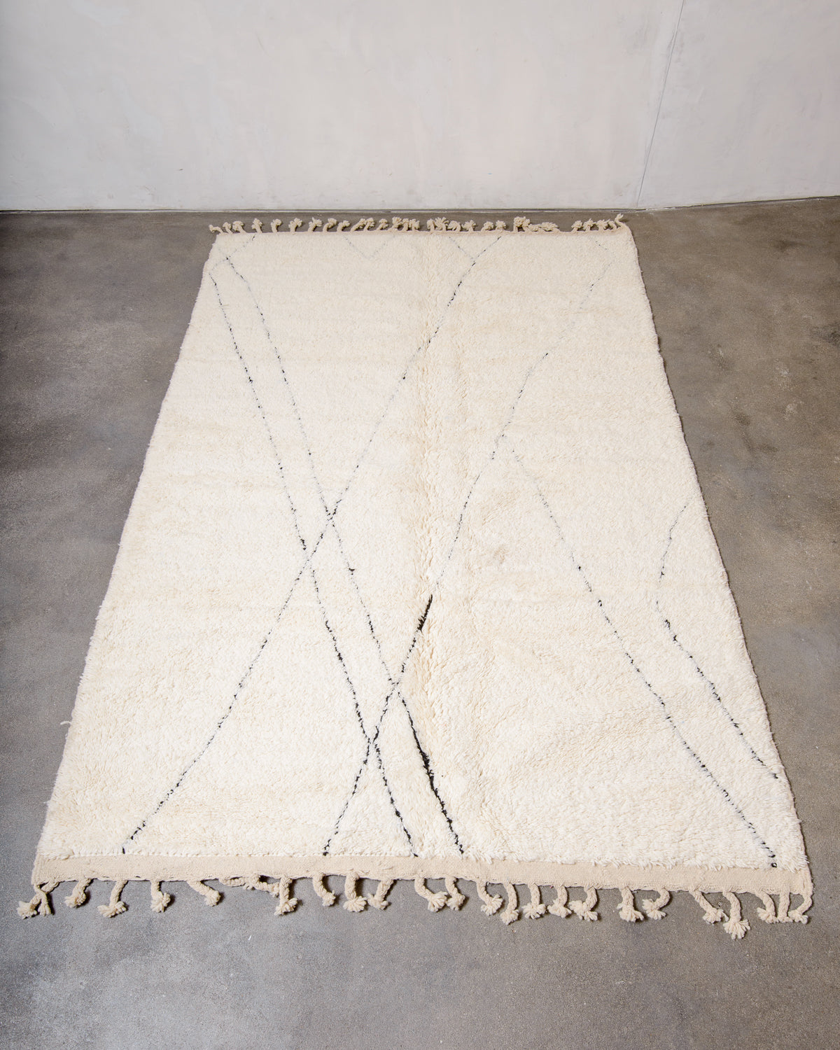 Modern, designer, handcrafted Berber rug from Morocco. Beniourain carpet with minimalist design, natural wool pile and a fluffy texture.